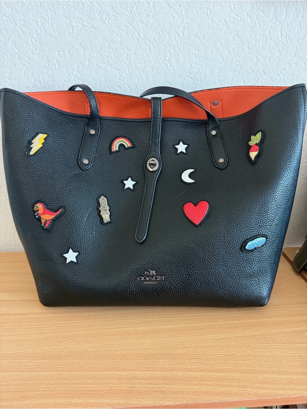 Coach Black Rocket Motif Tote with Orange Interior and Patch Accents
